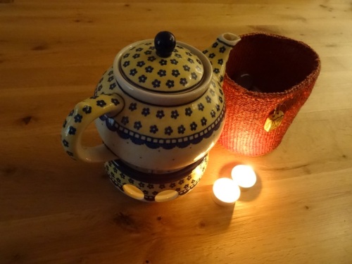 Teapot and lit tealights